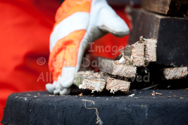 Gathering up the sawn-off bits of wood