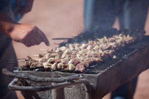 Llama kebabs, Machuca village, Atacama Desert, Chile Llama kebabs on the grill, Machuca village, Atacama Desert, Chile