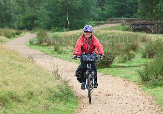 Cyclist on trail just beyond Slippery Stones Bridge, Howden Reservoir, Derbyshire